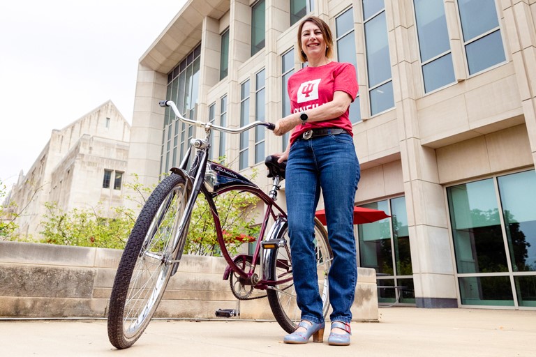 Dean Mooney with bike in front of O'Neill School