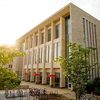 O'Neill building with red umbrellas out front