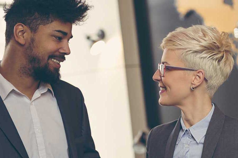 Two students in front of a stylized map